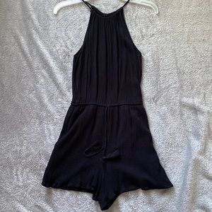 Worn once. Black romper.